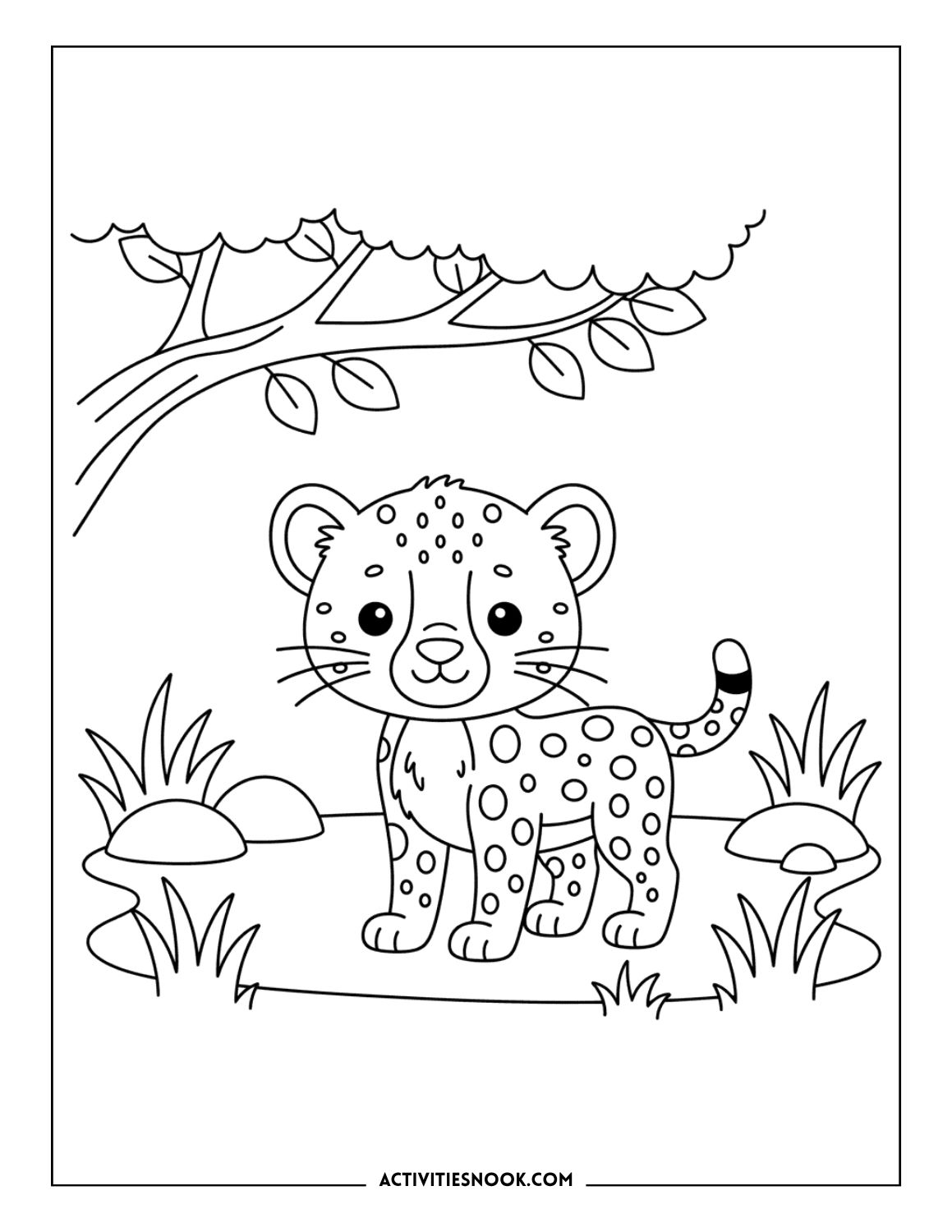 Cartoon-style baby cheetah standing under a tree with rocks and grass around it.